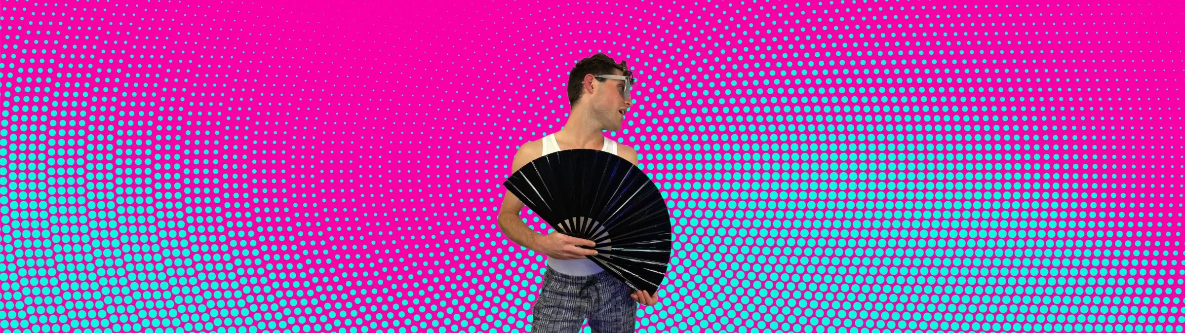 Man holding a silver metallic clack fan at a circuit party