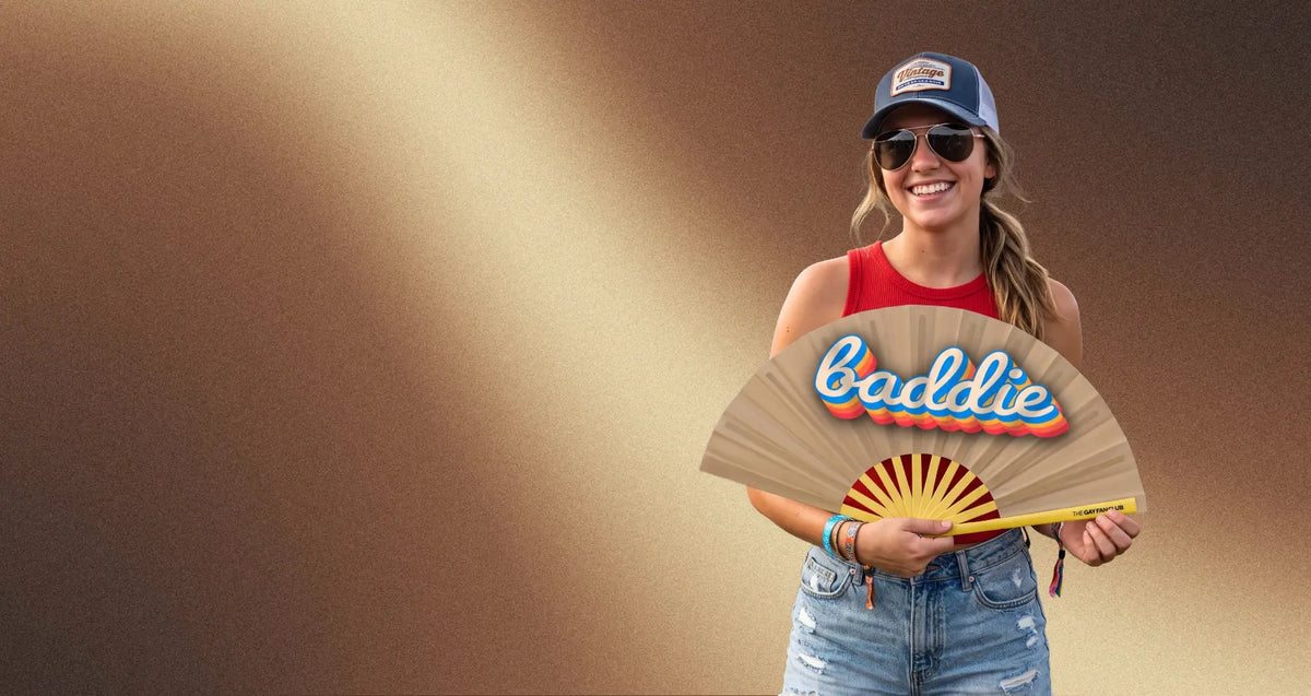 a girl holding a rainbow clack fan with a rainbow background