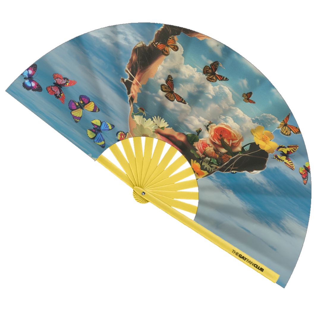 Head In The Clouds Fan fully open showing a vibrant blue sky and white cloud design on natural bamboo ribs.