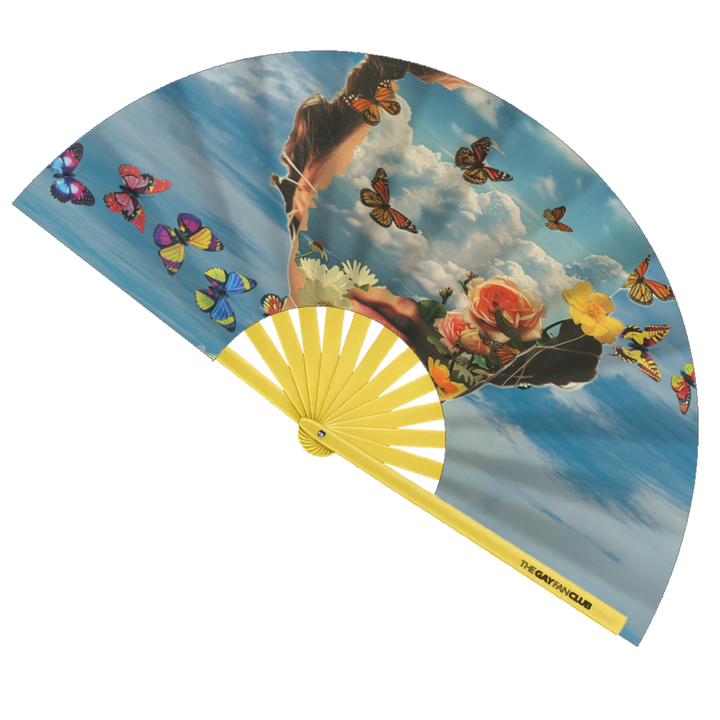 Head In The Clouds Fan fully open showing a vibrant blue sky and white cloud design on natural bamboo ribs.