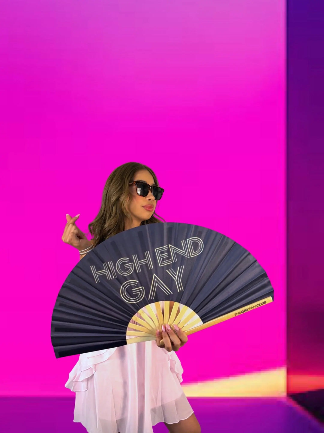 Woman holding a fan with &