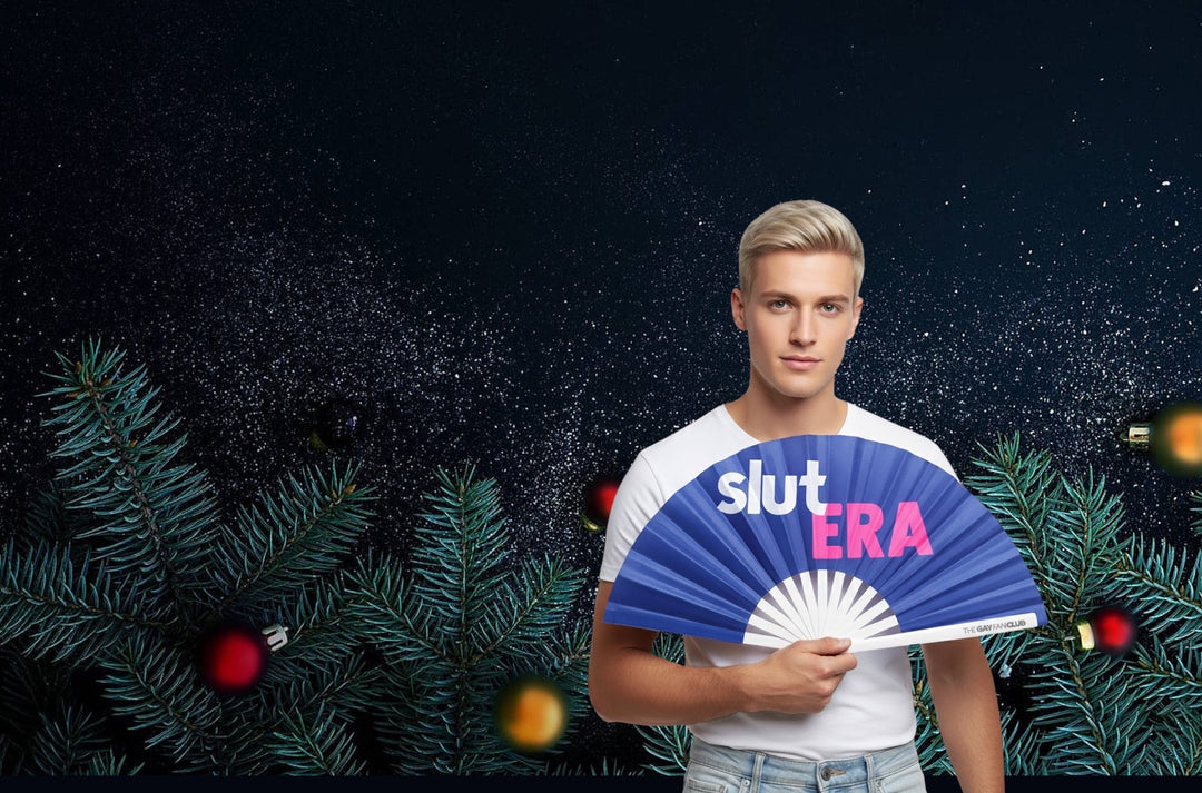 Person holding a fan with 'slut ERA' text against a festive background