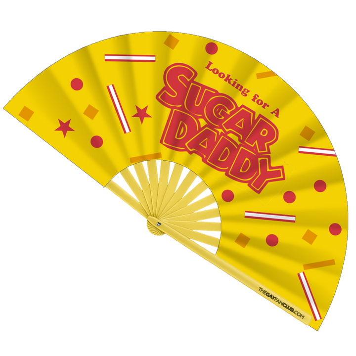 Oversized Bamboo Clack Fan with "Looking for a Sugar Daddy" Text in Red on a Bright Yellow Fabric