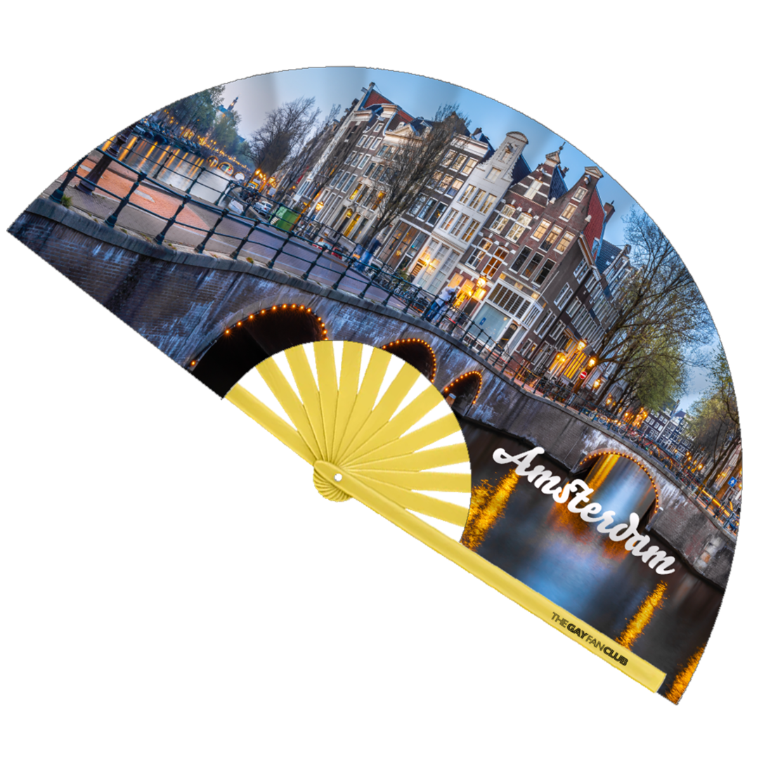 Amster-Damme Diva Fan fully open showing the Amsterdam, Netherlands canal house skyline and city lights on a natural bamboo frame.