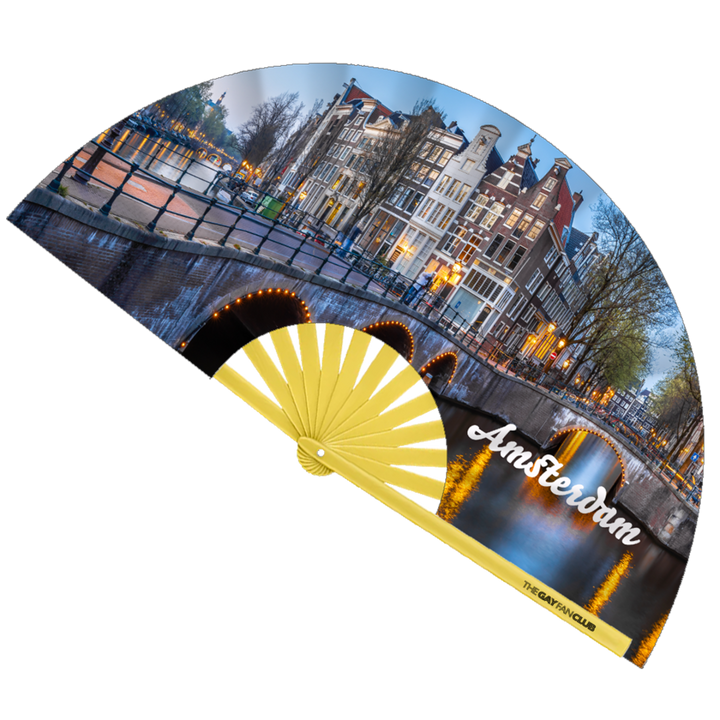 Amster-Damme Diva Fan fully open showing the Amsterdam, Netherlands canal house skyline and city lights on a natural bamboo frame.