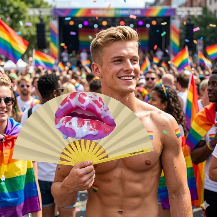 A person at a pride parade snapping the Taste The Rainbow Fan open for a dramatic clack during a high-energy performance.