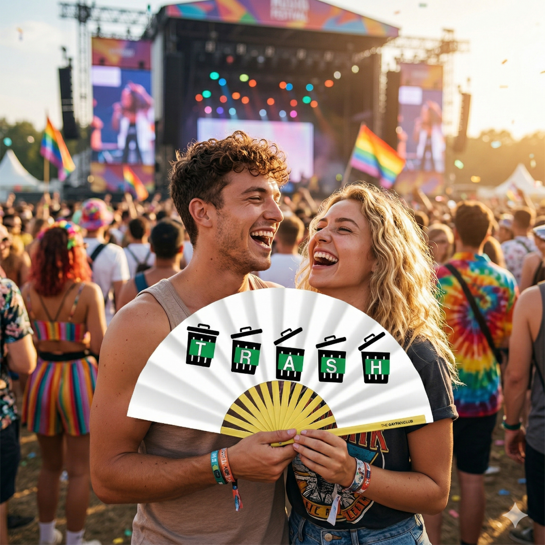 Two people at a music festival holding a &
