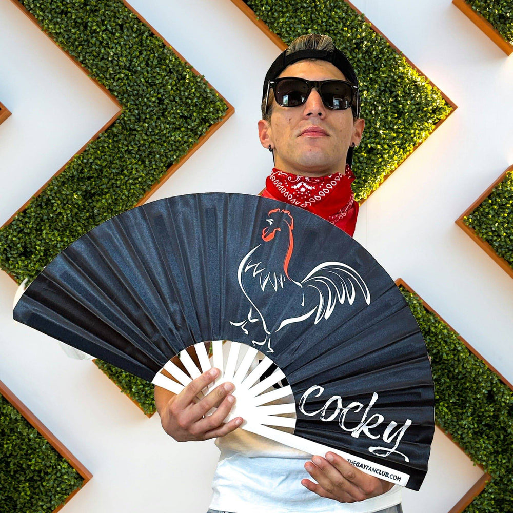 Person holding the Black "Cocky" Statement Bamboo Hand Fan